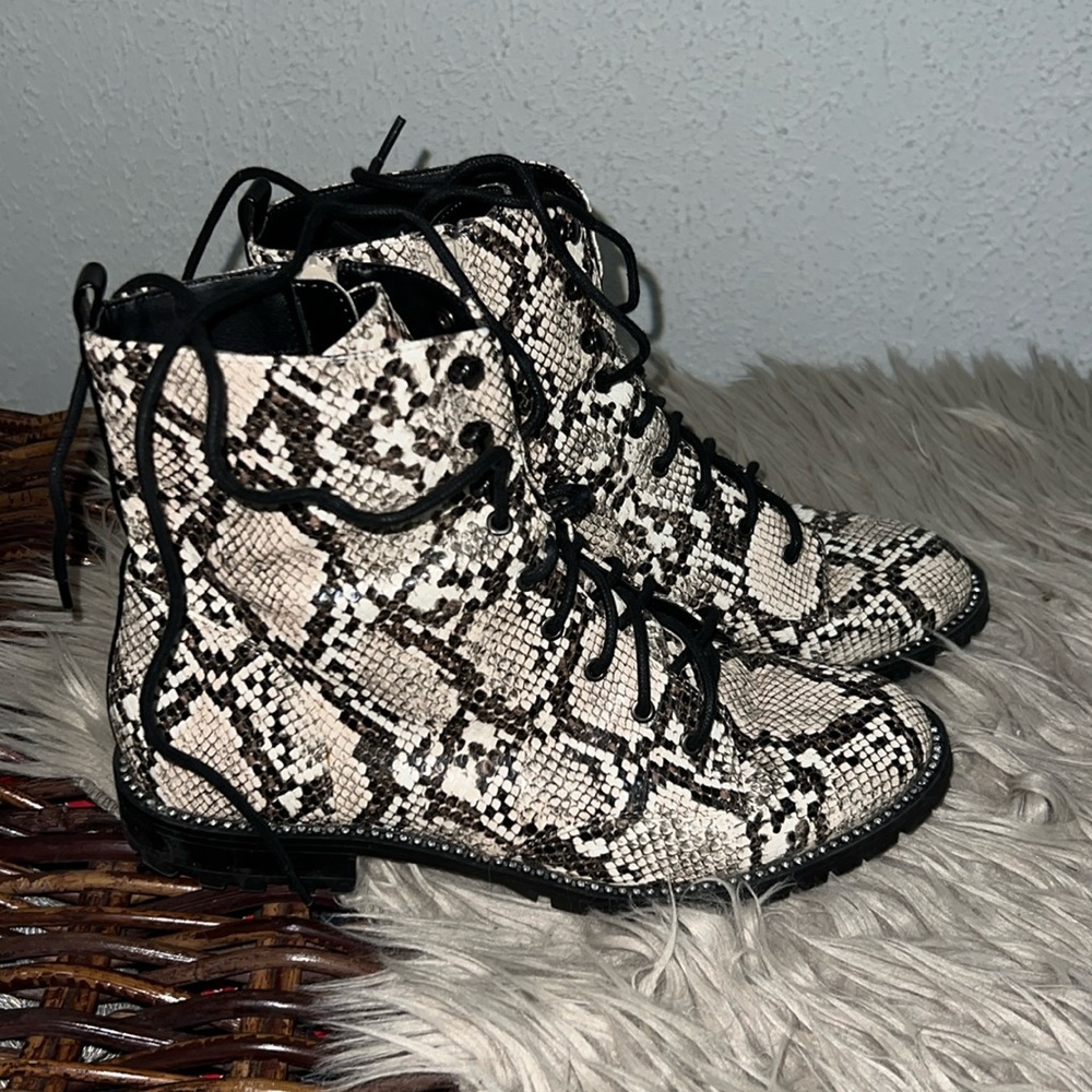 Snake skin Boots from EXPRESS. They are black and cream colored. Have been worn.